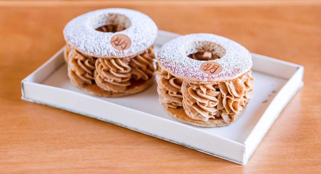 A doughnut sitting on top of a wooden table