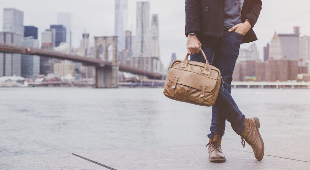 A man carrying a suitcase