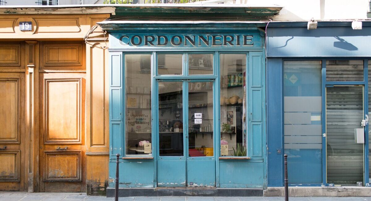A store front with a blue door