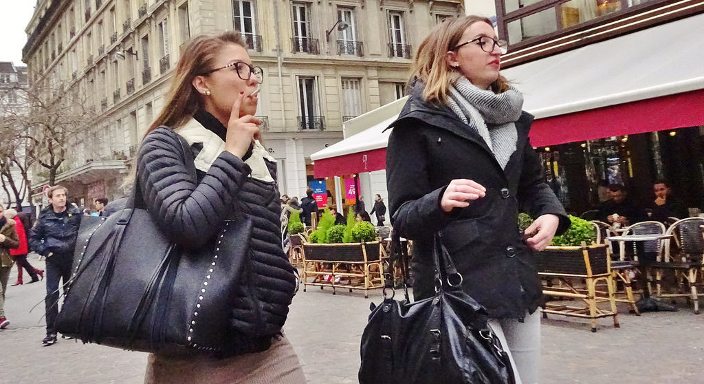 can you smoke cigarettes in paris No Smoking Zones Expand Across Paris: What Visitors Need to Know This Summer Paris smoking street hi-res stock