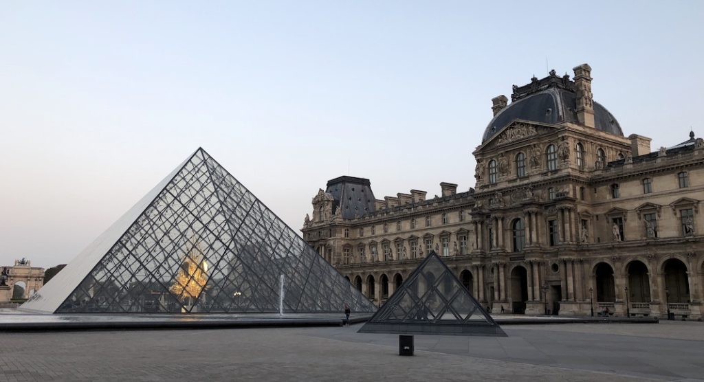 A large building with Louvre in the background