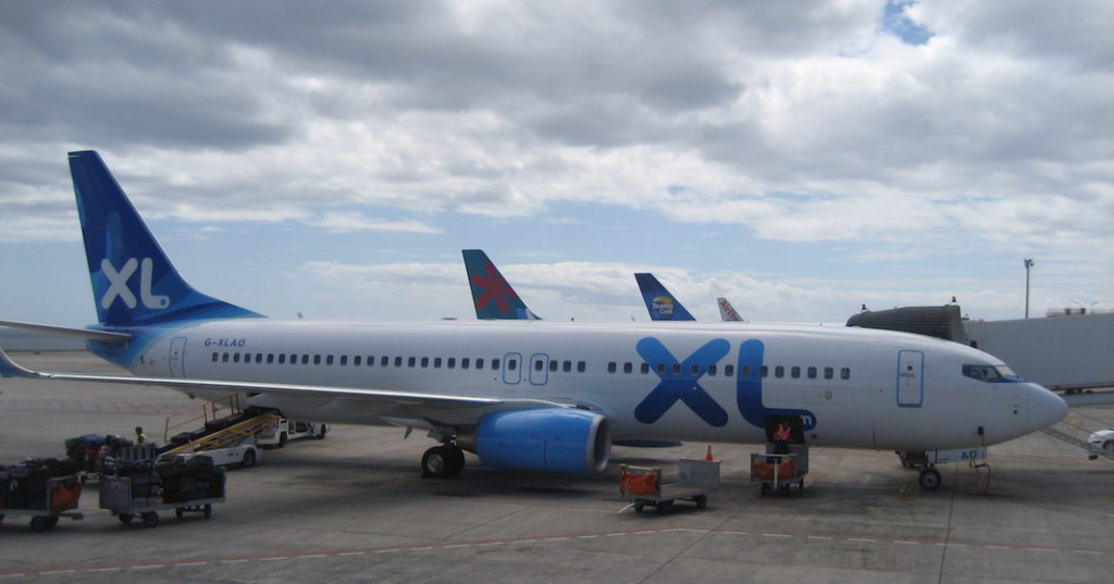 A large passenger jet sitting on top of a tarmac at an airport