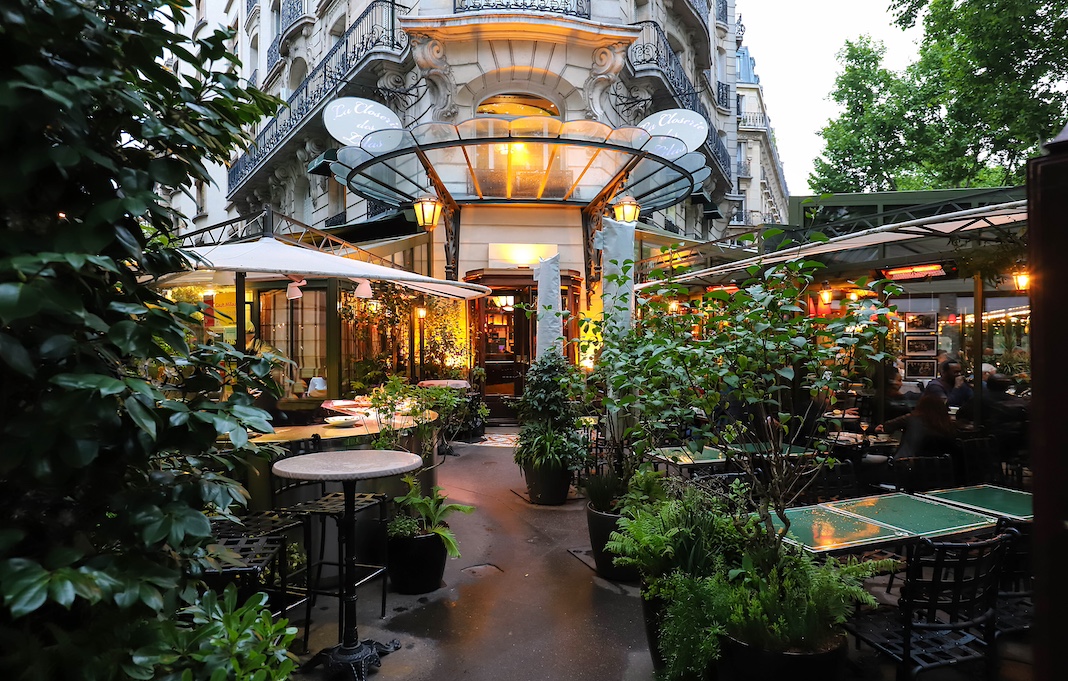 Exterior of restaurant swathed in greenery