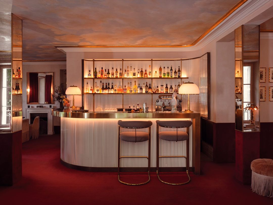 Bar interior with warm lighting and red carpet