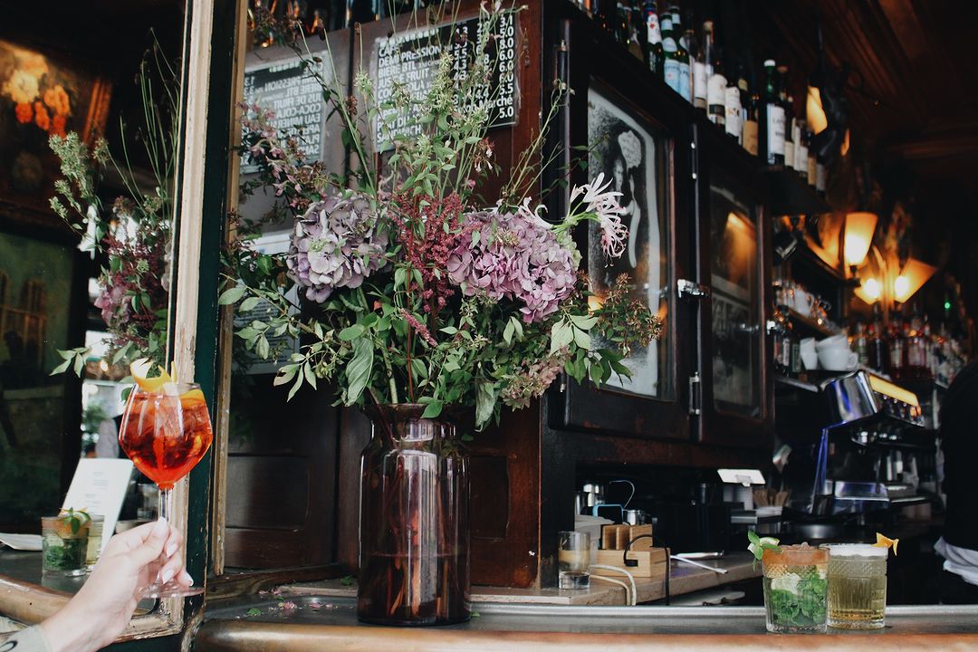 Flowers and spritz on bar