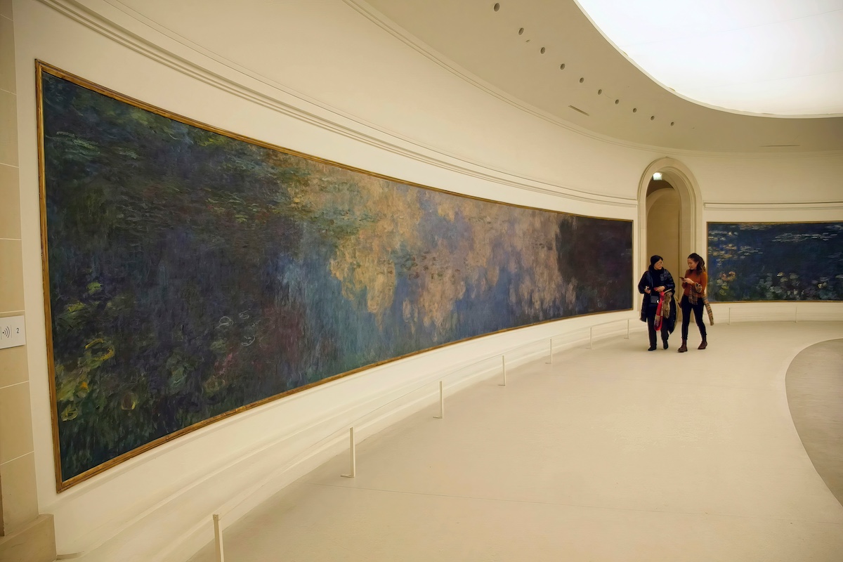 PARIS - DEC 5, 2018 - Visitors view Monet's giant water lily oils in L'Orangerie Museum, Paris, France