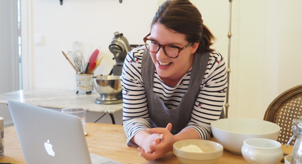 A woman sitting at a table eating food