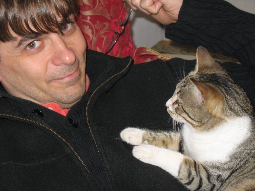 A man holding a cat
