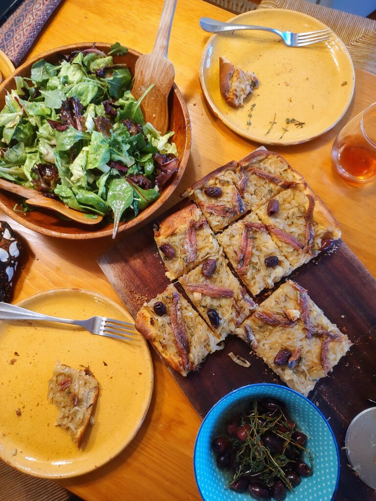 A pizza sitting on top of a wooden table