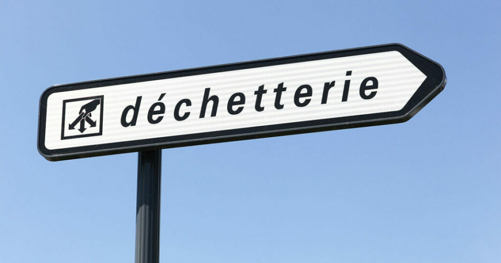 A close up of a street sign on a pole