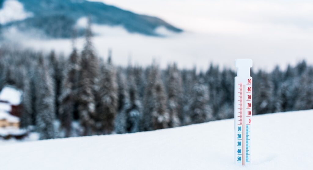 Thermometer in the snowy Alps