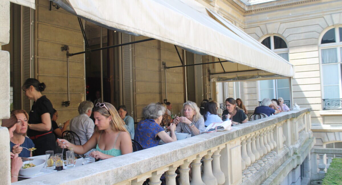 People dining on a shaded terrace