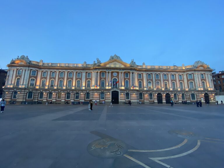 A large building with Capitole de Toulouse in the background