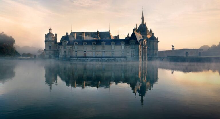 A castle surrounded by a body of water