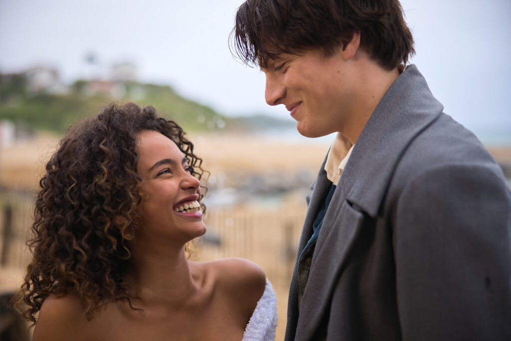 A man and a woman looking at the camera