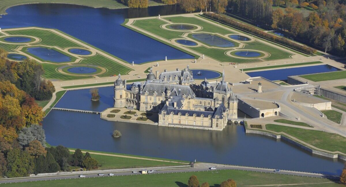 A castle on top of a grass covered field