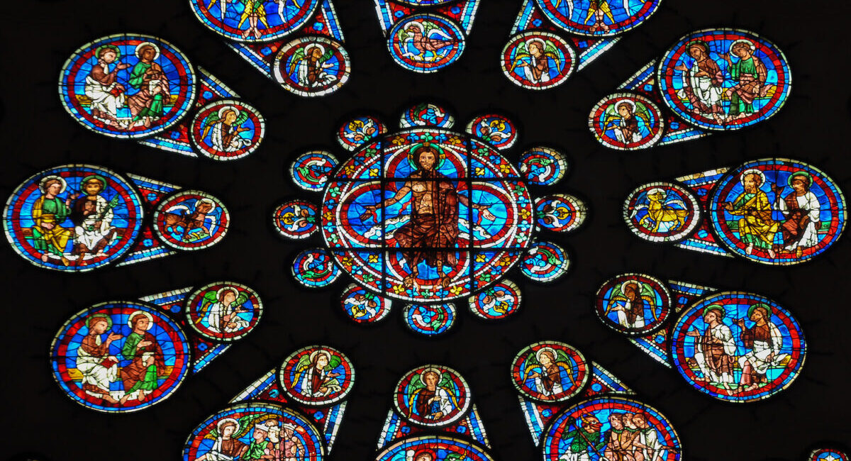A group of people painted on the side of Chartres Cathedral