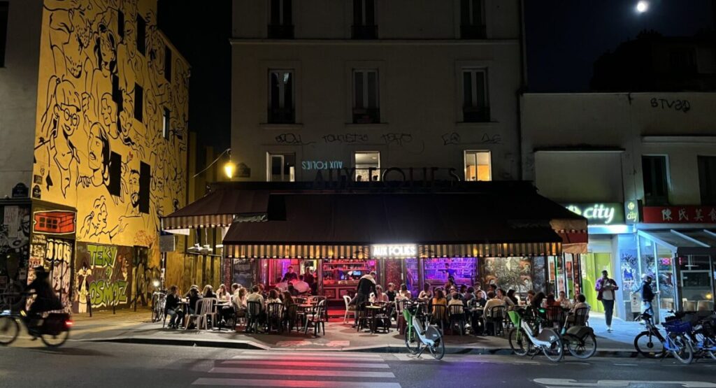 A group of people riding motorcycles on a city street