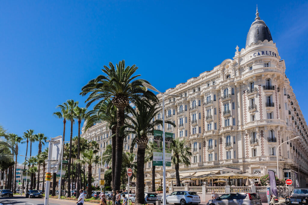 CANNES, FRANCE - JULY 10, 2014: Luxury hotel "Inter Continental Carlton" (343 rooms, built in 1911), located on the famous "La Croisette" Boulevard in Cannes, French Riviera.