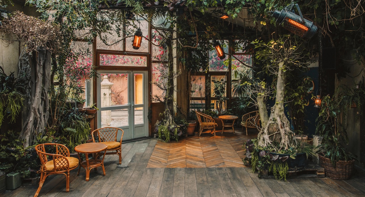 Bar interior filled with lush greenery