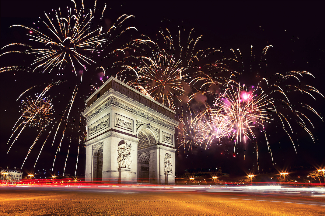Arc De Triomphe (Paris, France) with fireworks during New Year celebration