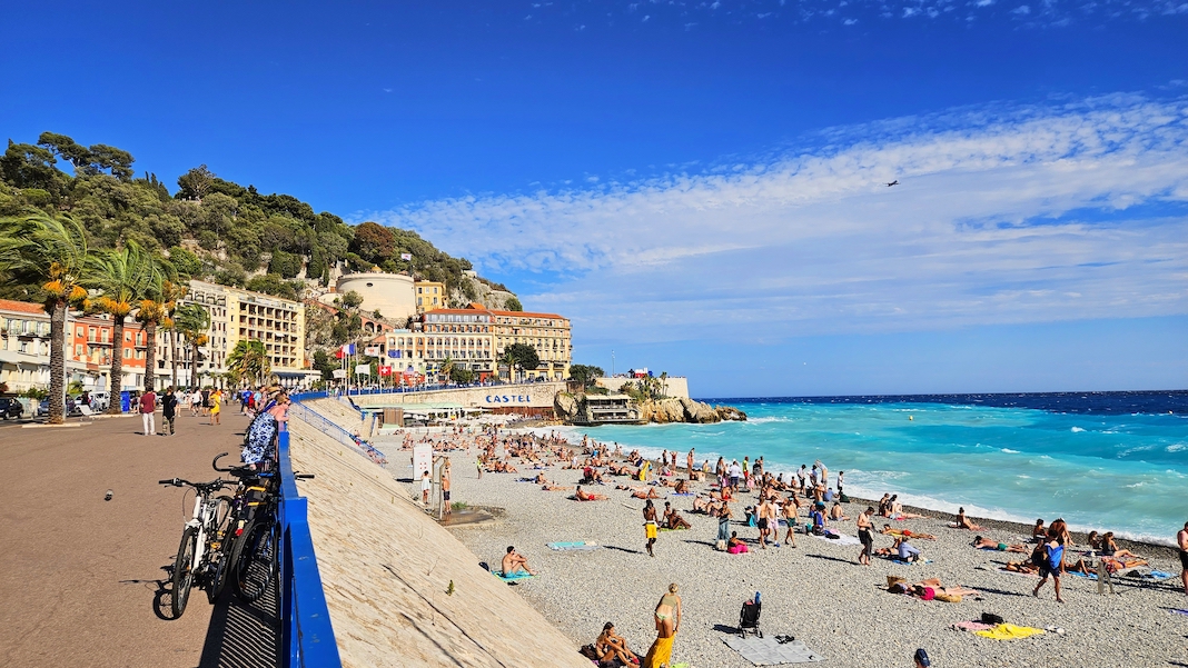 Nice, Cote d'Azur, France - 09.14.2023: Promenade des Anglais, beach season city beach of Nice - Plage Publique de Castel beach, Plage des Ponchettes
