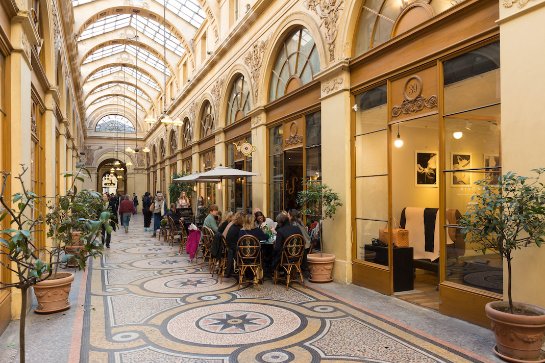 PARIS, FRANCE - MARCH 25, 2017: Galerie Vivienne (1823). Vivienne Covered Passage is 176 meters long, with shops, restaurants and tourist attraction.
