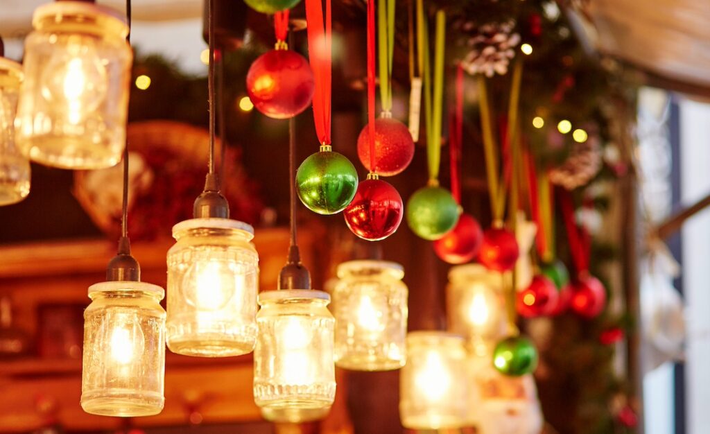 Colorful Christmas decorations and glass lanterns in French Christmas market