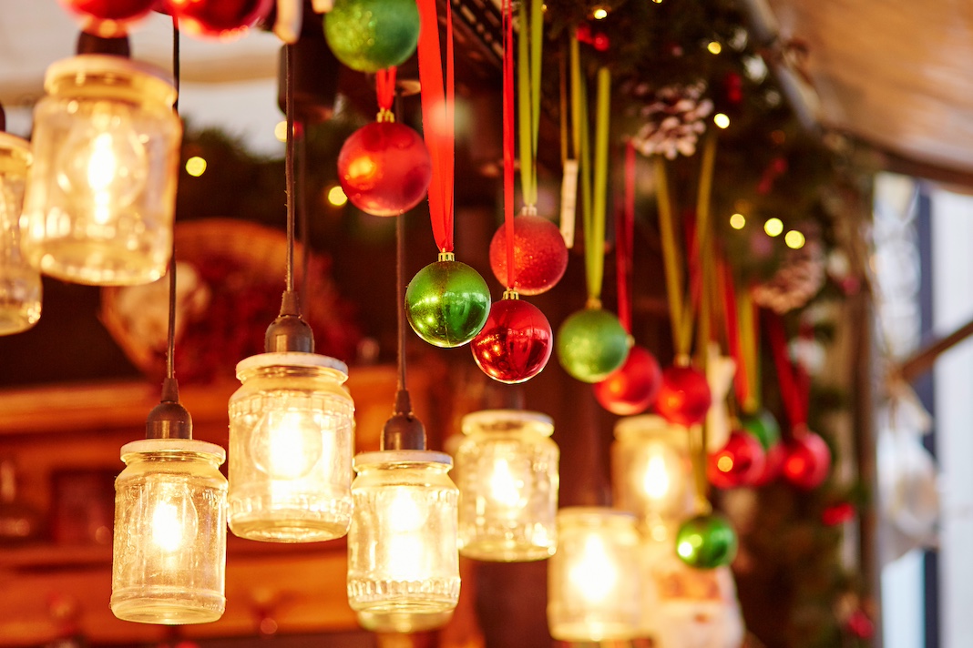 Colorful Christmas decorations and glass lanterns in French Christmas market