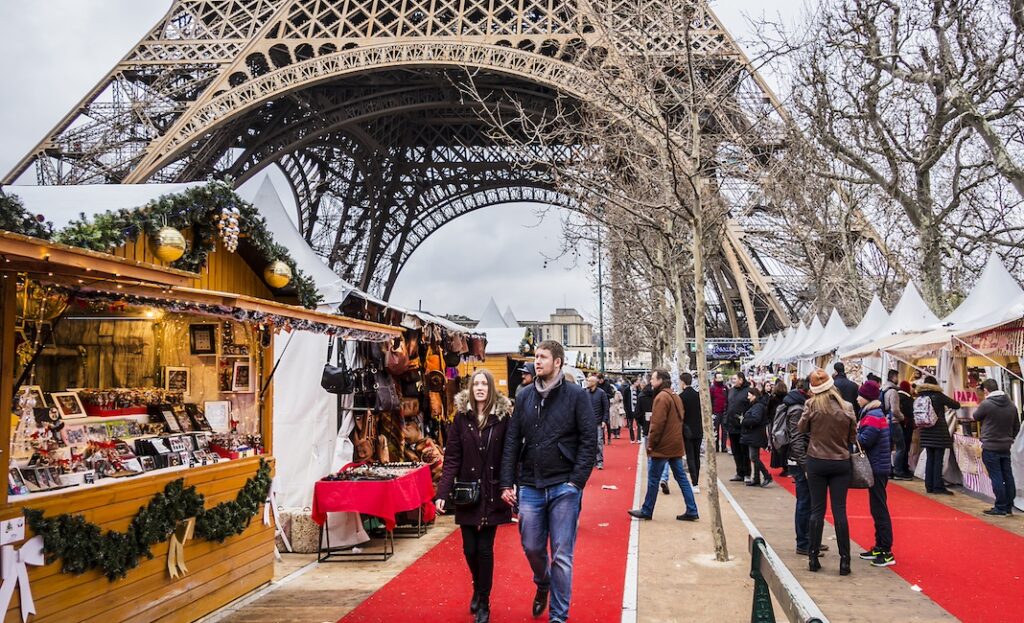 PARIS, FRANCE - DECEMBER 22, 2017: Traditional Christmas markets near the Eiffel tower on Champ de Mars in Paris.