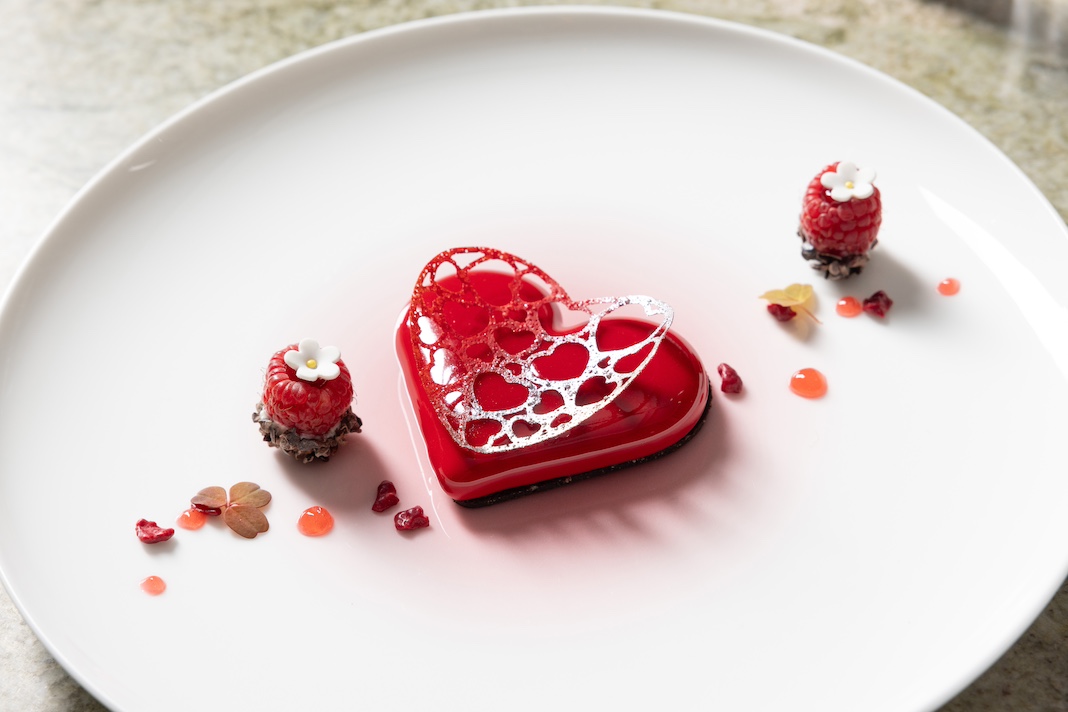 Heart-shaped dessert on white plate