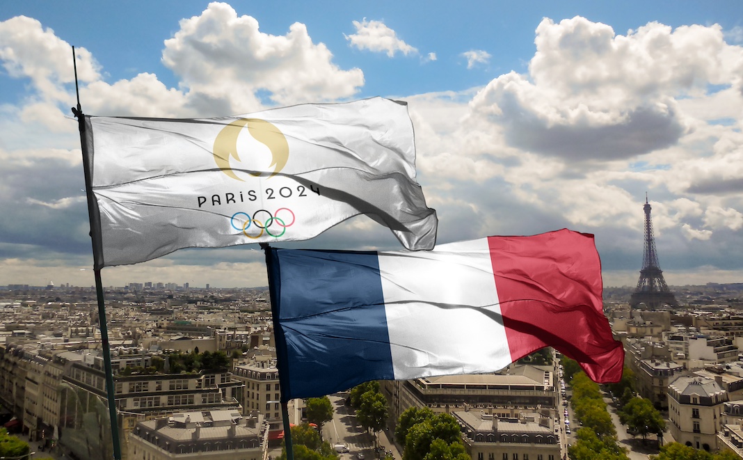The Paris Olympic flag beside the French national flag