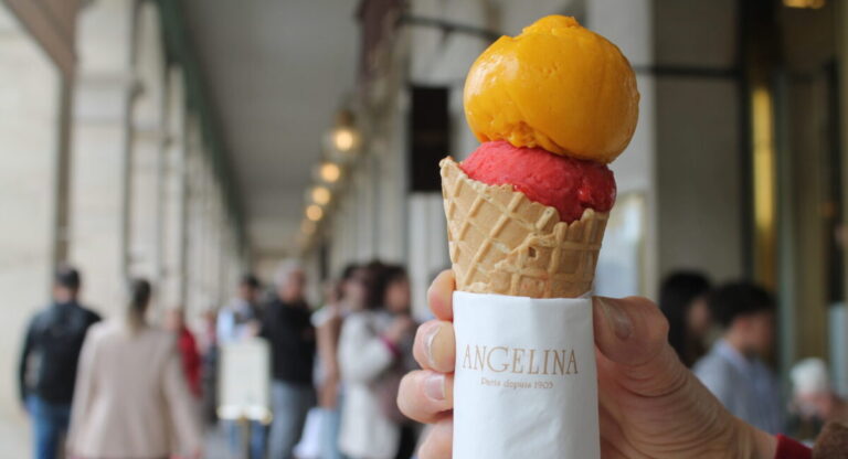 Ice cream with colorful scoops, held with Angelina brand napkin