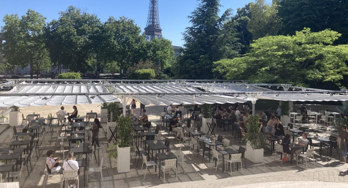 Outdoor cafe with view of the Eiffel Tower