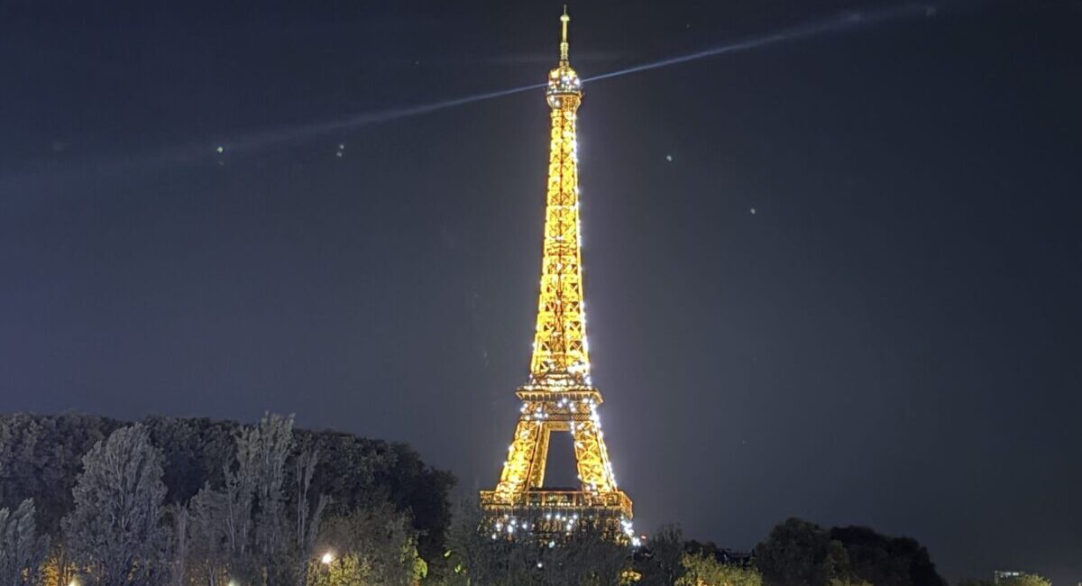 Glowing Eiffel Tower seen from the Pont de l'Alma.