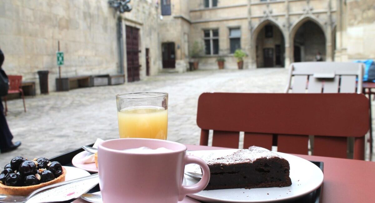 Cake, coffee, and other treats at outdoor cafe