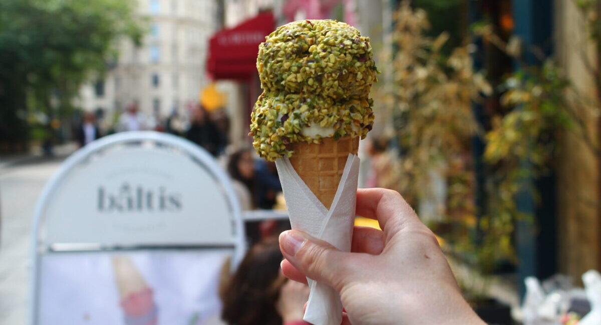 Pistachio-crusted ice cream on cone