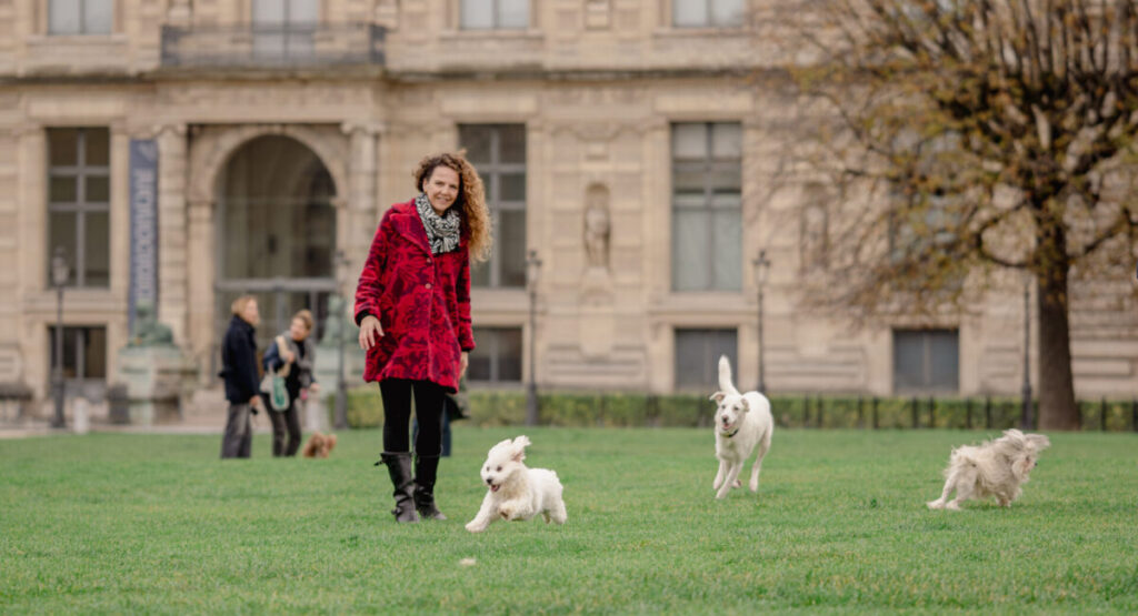 Woman with her dog in the Tuileries.