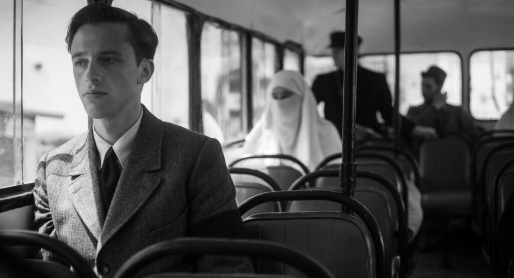 A man sits on a bus.