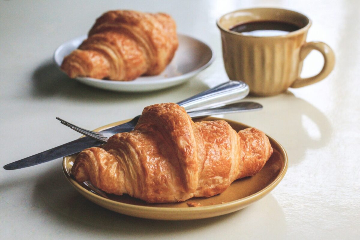 Croissant and coffee French breakfast food. 