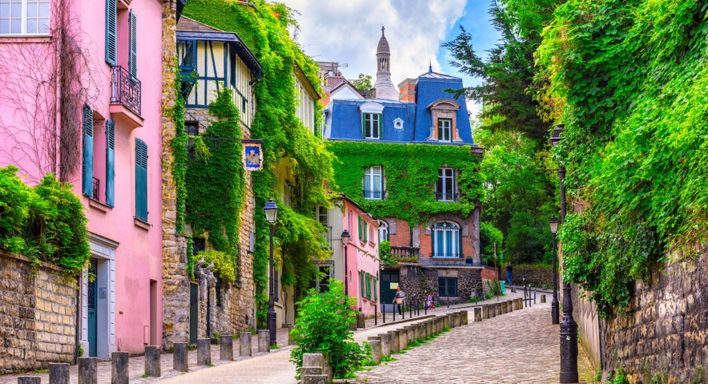 Street in quarter Montmartre in Paris, France. Cozy cityscape of Paris. Architecture and landmarks of Paris.