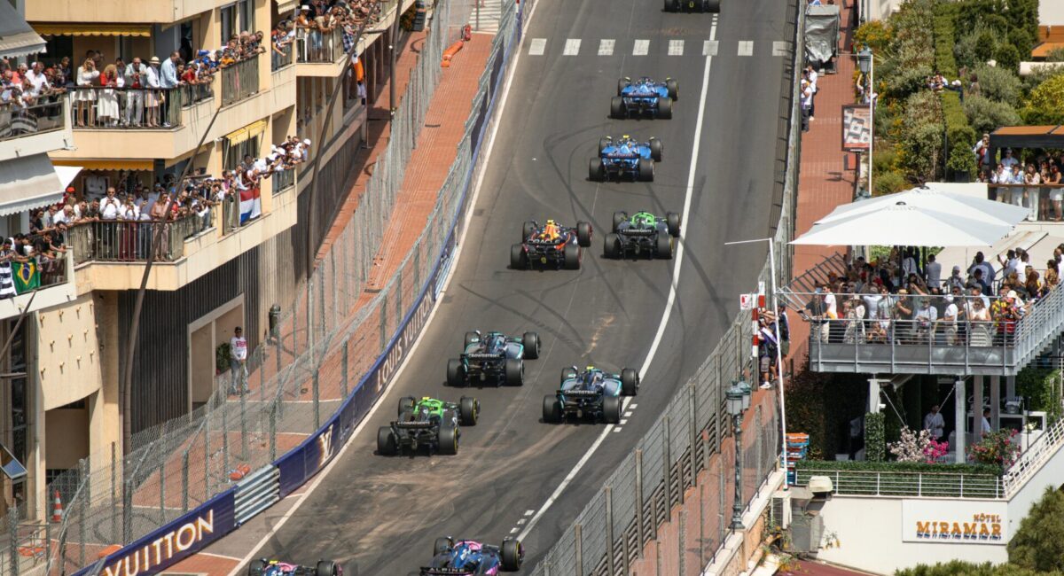 cars racing down monaco streets