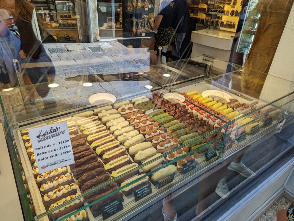Montpellier, France - 09 21 2022 : A view of the display window at the bakery Maison Bonnaire, filled with different flavours of eclairs.
