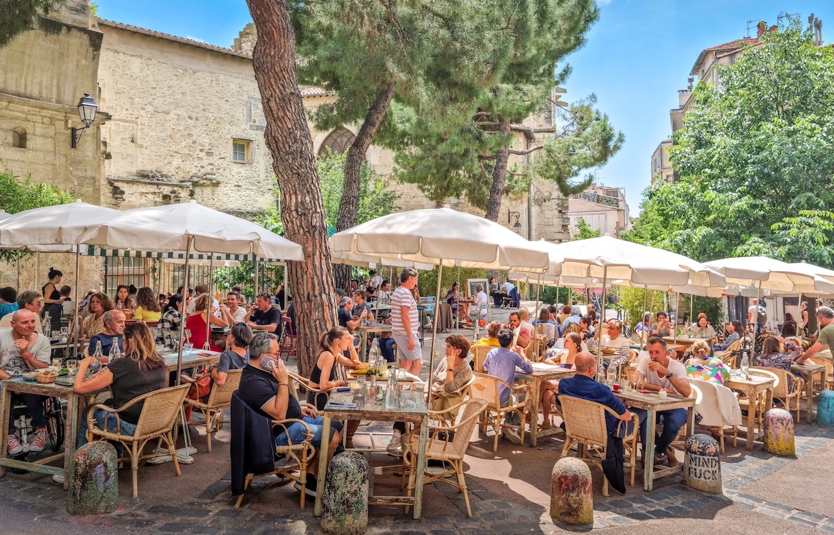 Montpellier, France - 22 May, 2023: People enjoying the bars in the city center. The squares are one of the best places to try the local cuisine.