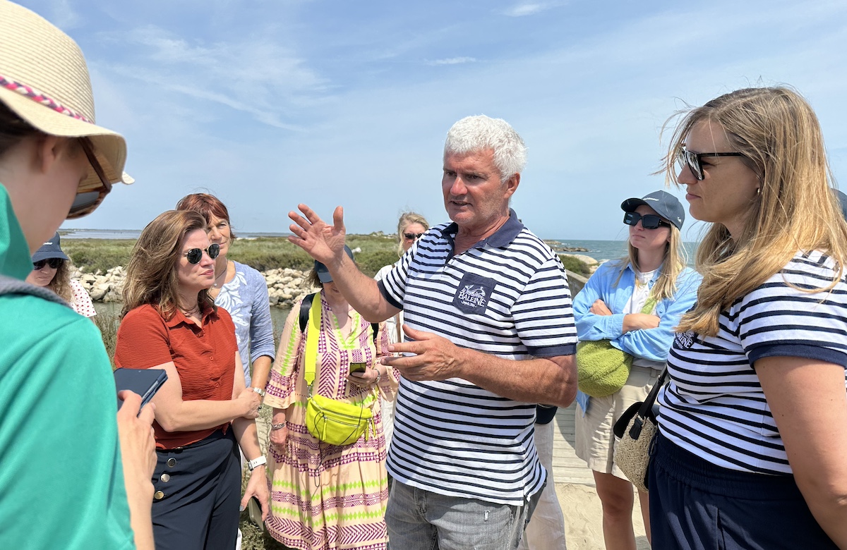 A saunier explaining the process of harvesting salt