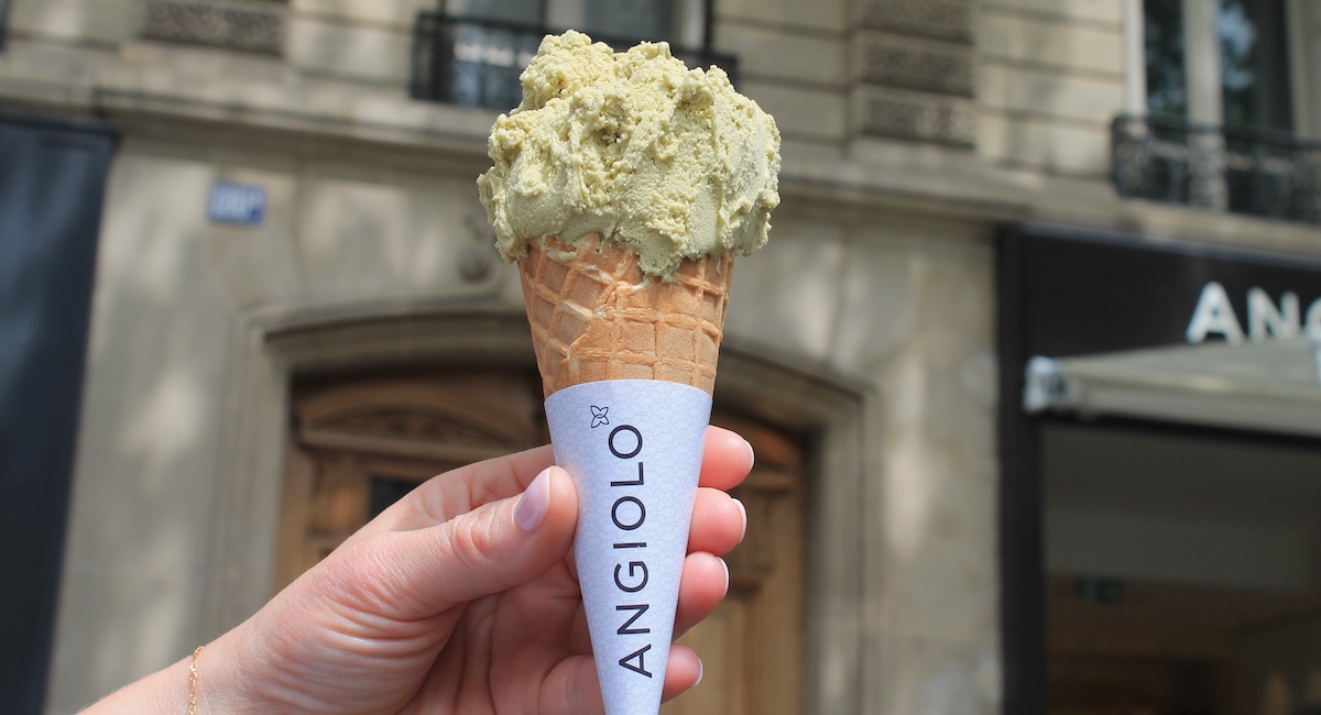 Close up on person holding ice cream cone