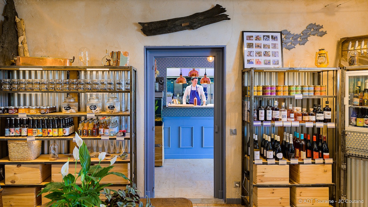 View of chef through doorway of pantry shop
