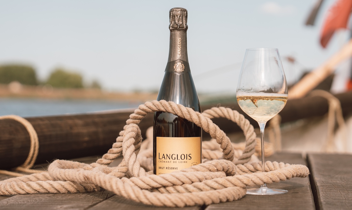 Bottle of wine wrapped in rope on boat