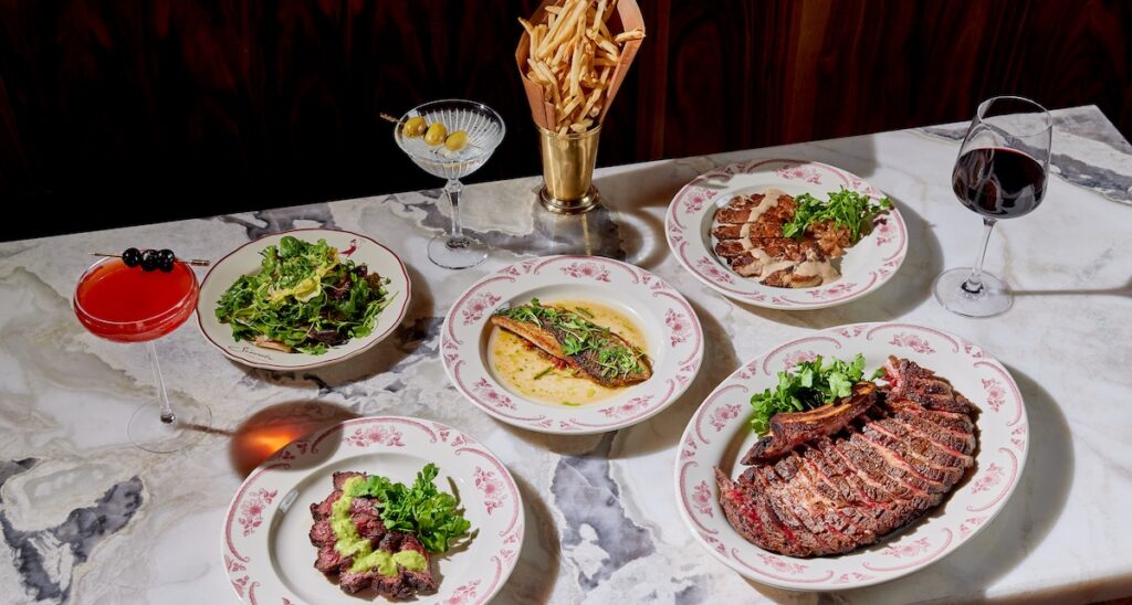 Extravagant spread of French dishes on marble tabletop