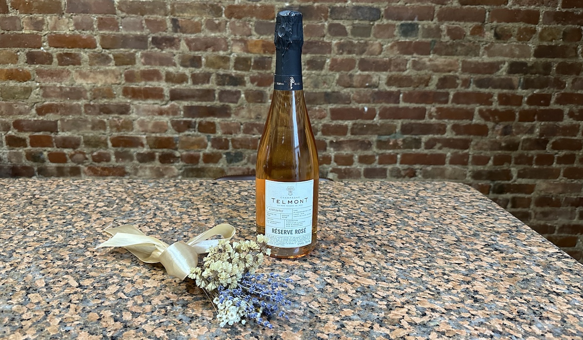 Bottle of champagne with dried flower bouquet
